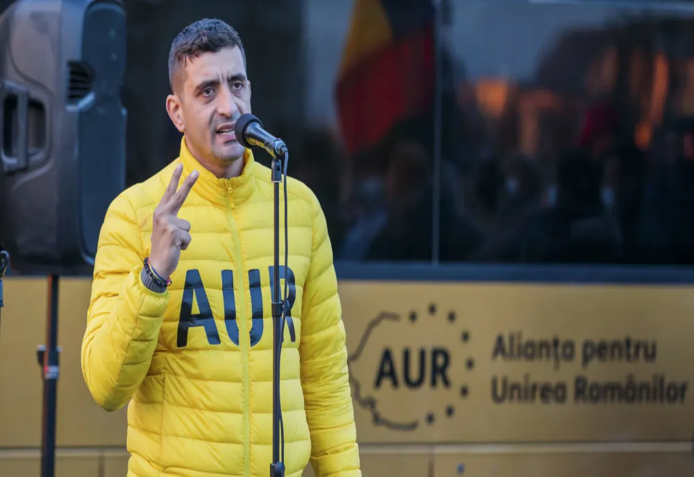 FOTO George Simion a adus un călugăr în Parlament. “Poate mai scoatem din dracii de aici”